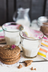 Rustic home made cookies on the wooden background with milk