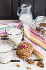 Rustic home made cookies on the wooden background with milk