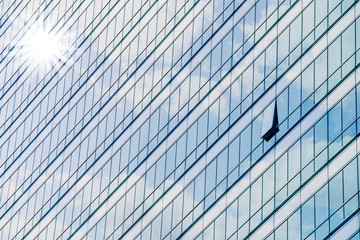 Clouds reflected in windows of modern office building