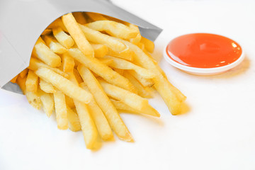 french fries in white box with chili sauce