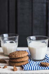 Rustic home made cookies on the wooden background with milk