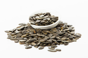 pumpkin seeds isolated on white background. Fresh roasted Pumpki