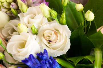 beautiful wedding ring in a wedding bouquet of flowers