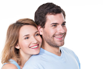 Portrait of smiling embracing couple.