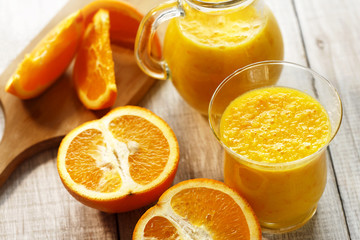 Obraz na płótnie Canvas fresh orange smoothie in glasses