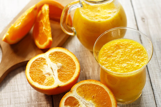 fresh orange smoothie in glasses