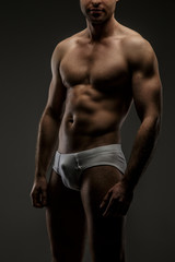 Fototapeta premium Man with naked torso posing in studio