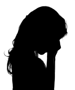 Silhouette of crying little girl.