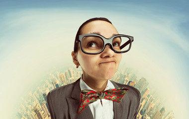Funny dreaming nerd girl