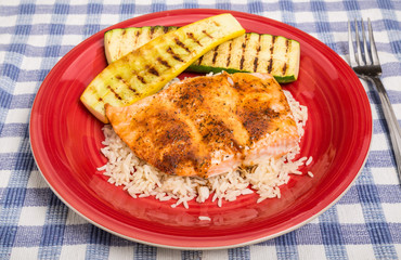Salmon on Rice with Squash on Red Plate