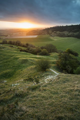 Stunning vibrant Spring sunrise over English countryside landsca