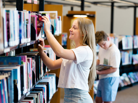 Teenage girl in library