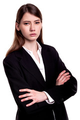 Confident young businesswoman / student arms crossed in Studio