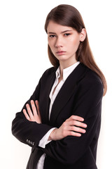 Confident young businesswoman / student arms crossed in Studio