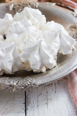 Fototapeta na wymiar White meringue on plate served in elegant style.