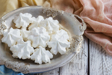 White meringue on plate served in elegant style.