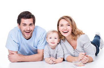 Smiling young family with little child.