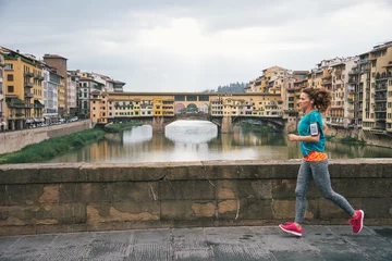 Peel and stick wall murals Ponte Vecchio Fitness woman jogging in front of ponte vecchio in florence