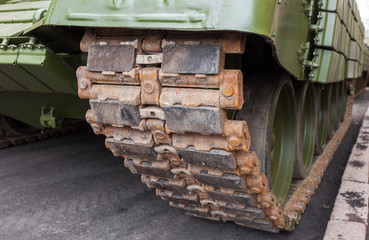 Fototapeta na wymiar Caterpillars of a military tank close up detail