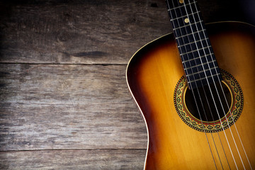 Fototapeta premium Guitar against a rustic wood
