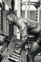 Fototapeta na wymiar Handsome black male bodybuilder resting after workout