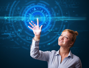 Young tech woman pressing high technology control panel screen c
