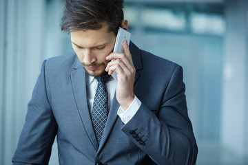 businessman talking by phone in the office