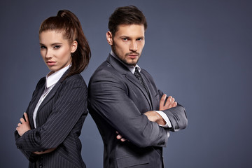 A couple of managers in suits on the blue background