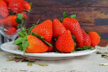 fresh strawberries on a white plate