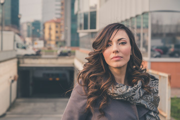 Beautiful girl posing in an urban context