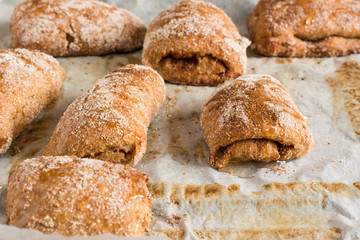 Fresh  buns or cakes of wheat on the parchment paper