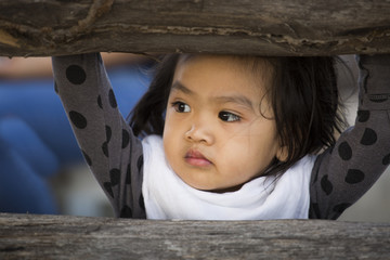 Asian baby behind the windows