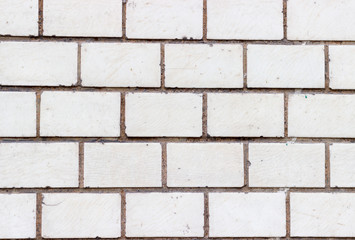Brick wall of bricks with white