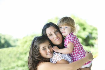 Fototapeta na wymiar Mother with her beautiful daughters