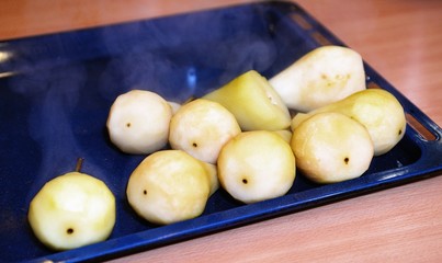 Pear which is wrapped up on baking tray
