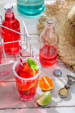 Cold summer drink with citrus fruit