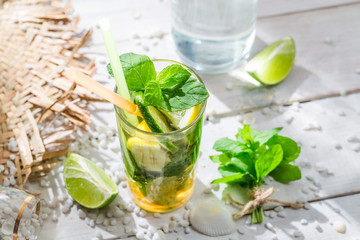 Cold summer drink with lemon and lime