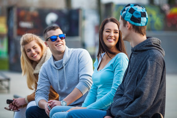 Group of young people hanging out in a skate park