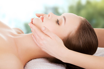 Woman recieving face massage.