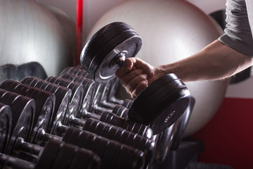 Gym equipment. Sport background. Dumbbell. Copy space