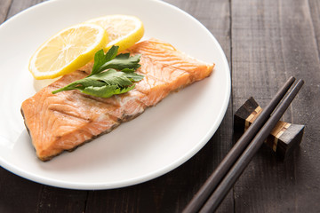 Grilled Salmon with lemon on dish