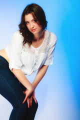 plus size woman in casual clothes posing in studio