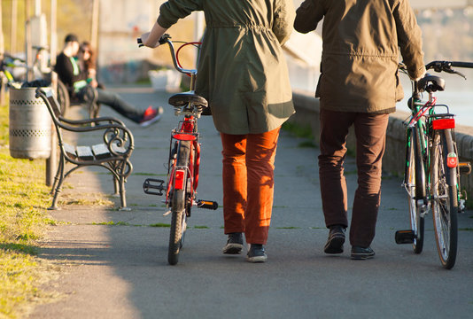 Couple walking with bicycles
