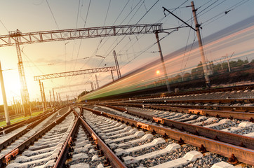 High speed passenger train on tracks with motion blur effect