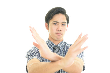 禁止の意思表示をするビジネスマン