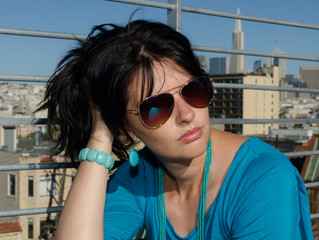 Young woman with San Francisco on the background