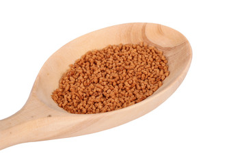 The Ginseng Tea wooden spoon on white background