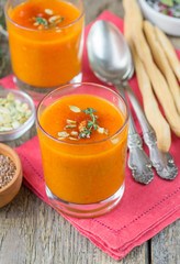 Pumpkin pureed soup in cups. Shallow depth of field