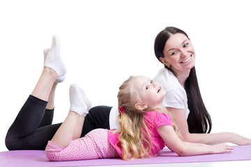 woman and child girl exercising together