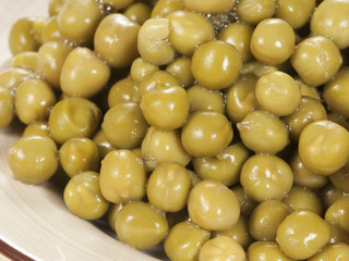 Green peas on a ceramic plate